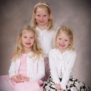 Portrait of 3 little girls in studio